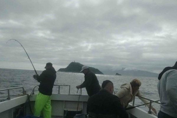 Angling_02 Men on board of boat holding fishing rods