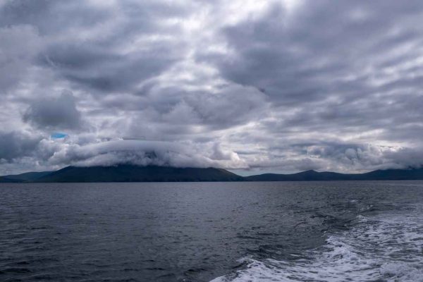 Inishkea_Island_06 (1) view of Inishkea Island from the boat with heavy clouds looming above it